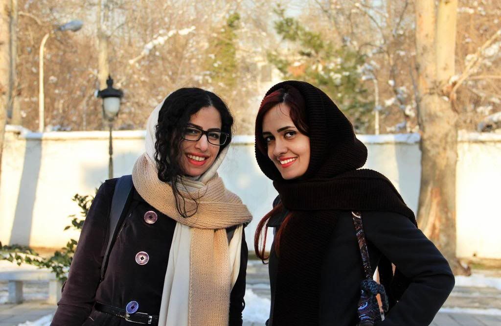 Two Iranian girls can be seen in winter outfits in Tehran.